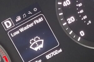 how to reset low washer fluid light